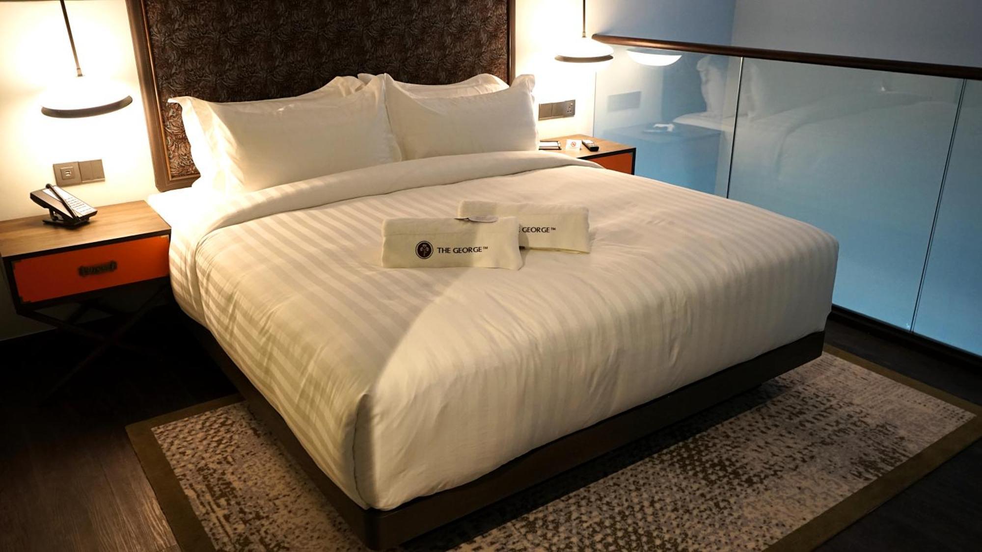Hotel The George Penang By The Crest Collection George Town Exterior foto A bed in a hotel room